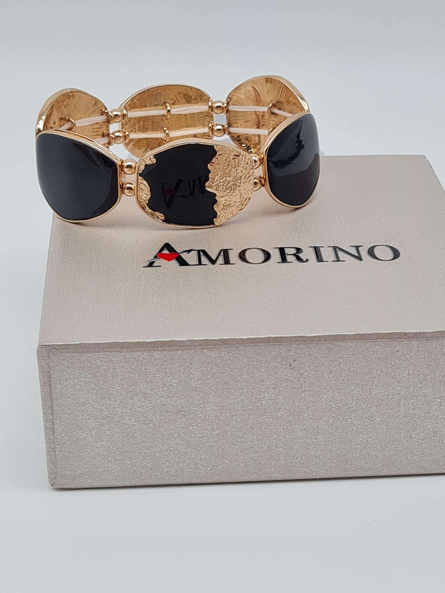 Amorino Armband, elastisches Armband Schwarz mit Goldene Verzierungen
