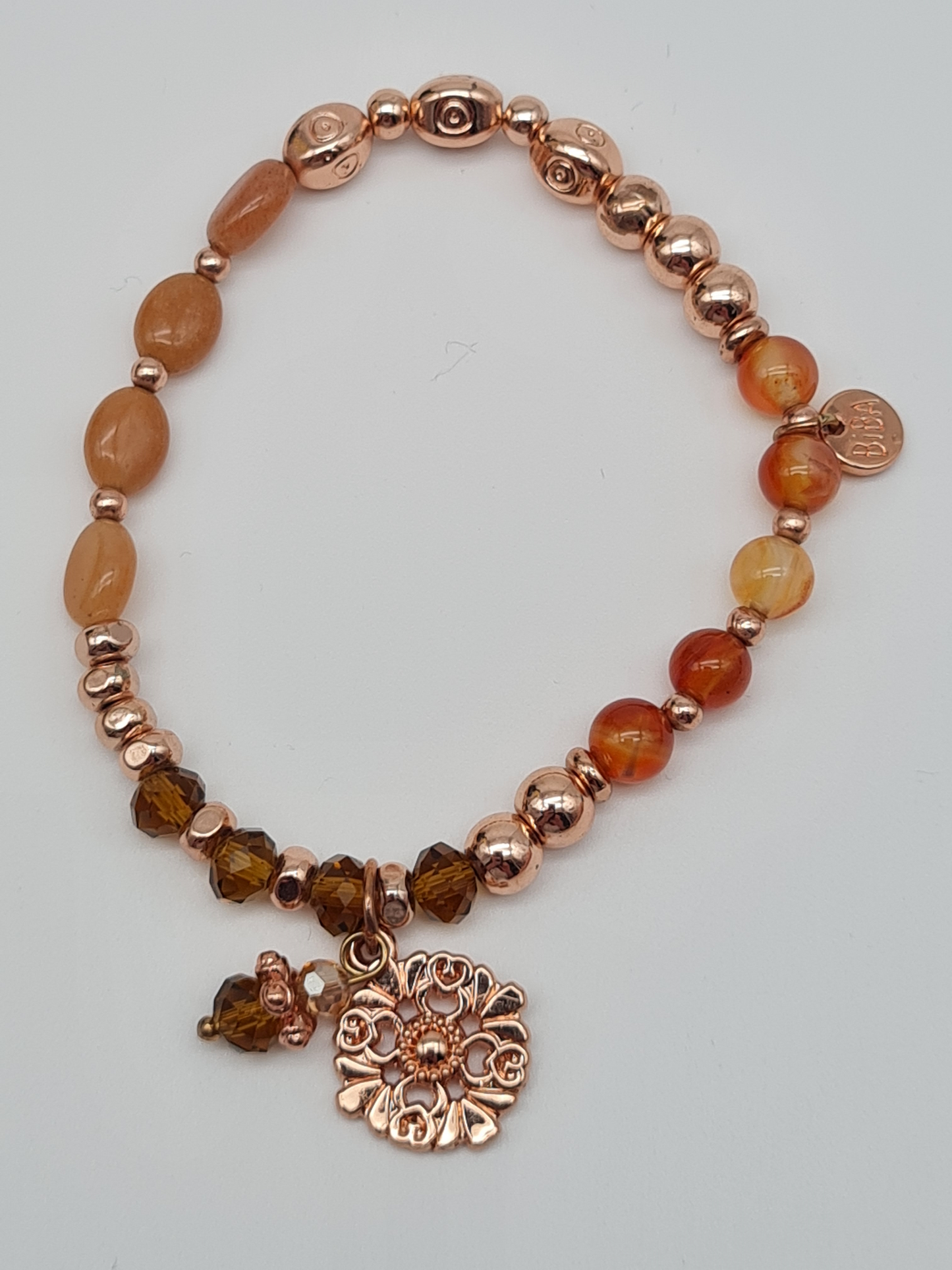 Biba Armband elastisch in Goldkupfer Lachstöne mit Blumenanhänger