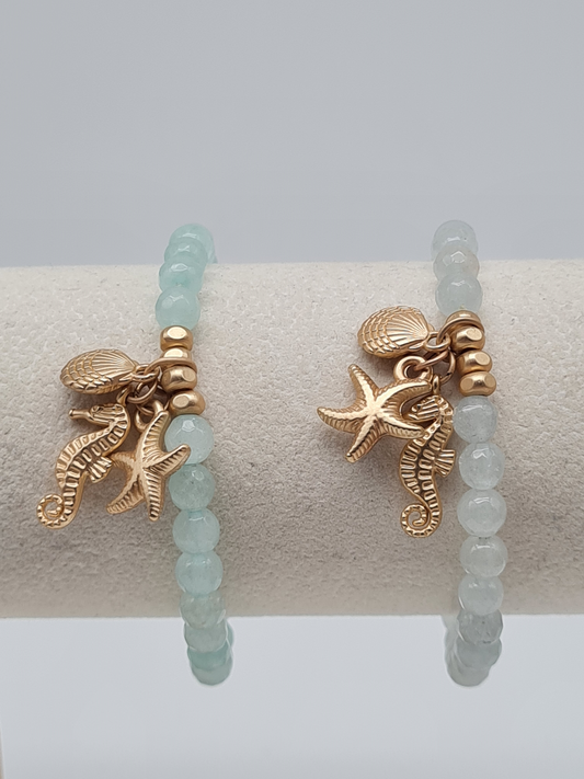 Biba Armband elastisch Helltürkis oder Hellblau mit Anhänger, Muschel, Seestern, Seepferdchen