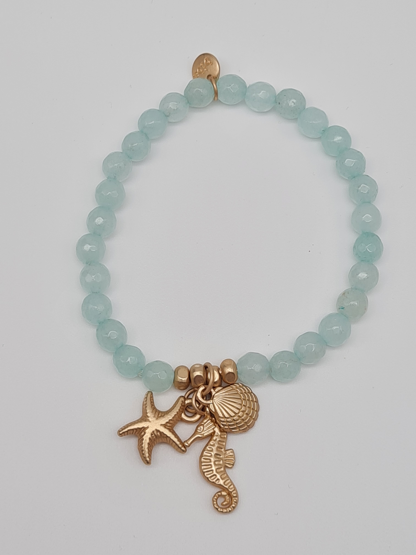 Biba Armband elastisch Helltürkis oder Hellblau mit Anhänger, Muschel, Seestern, Seepferdchen
