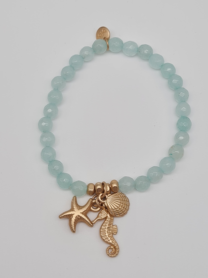 Biba Armband elastisch Helltürkis oder Hellblau mit Anhänger, Muschel, Seestern, Seepferdchen