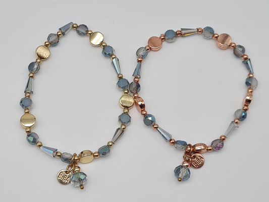 Biba Armband elastisch Hellblaue Transparente Goldene oder Roségoldene Elementen mit Anhänger