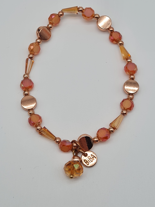Biba Armband elastisch in Goldkupfer mit warmen Orangetöne