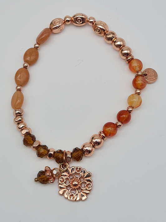 Biba Armband elastisch in Goldkupfer Lachstöne mit Blumenanhänger