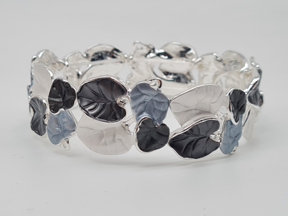 Amorino Armband, elastisch Tropenblätter in Lila-Braun und Grün-Töne Schwarz Silberfarben