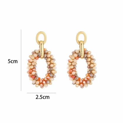 Michelle Bijou, Ohrringe,  Ohrhänger mit Anhänger aus Beige und Orange Glasperlchen