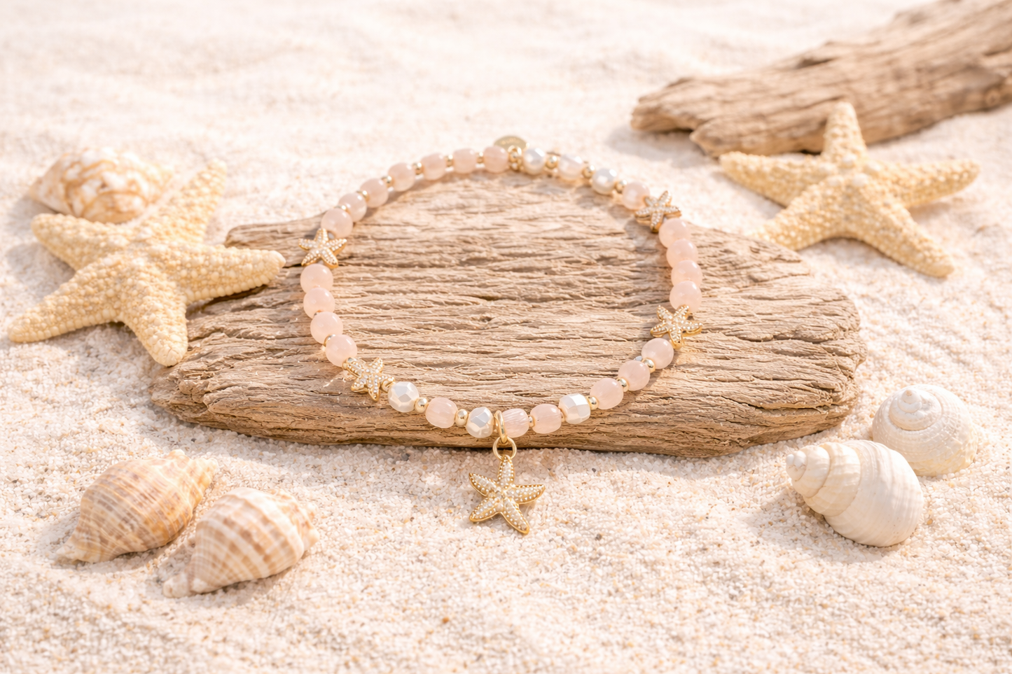 Armband elastisch Blassrosa goldene Seesternen Anhänger Trend Sommer Biba