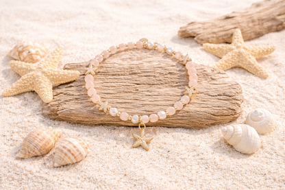 Armband elastisch Blassrosa goldene Seesternen Anhänger Trend Sommer Biba