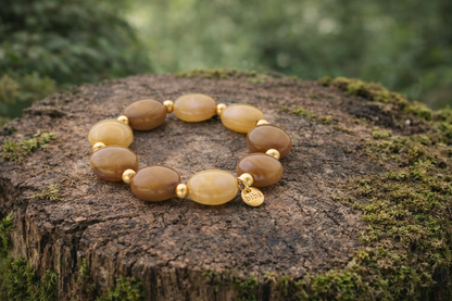 Armband elastisch Braun-Natur Lila-Töne Mat-Goldene Perlchen Nickelfrei Biba